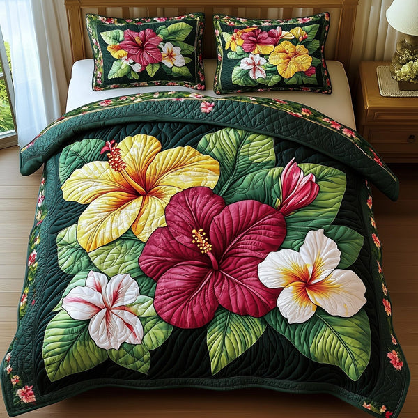 Tropical Blooming quilted 3-piece bedding set on a made bed in a light coastal bedroom