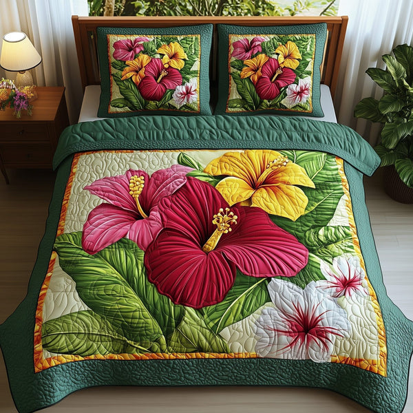 Tropical Blooming quilted 3-piece bedding set on a made bed in a light coastal bedroom