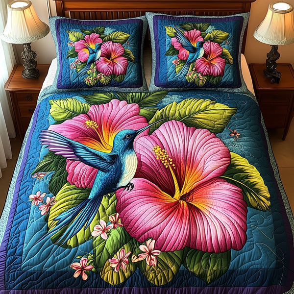 Tropical Blooming quilted 3-piece bedding set on a made bed in a light coastal bedroom