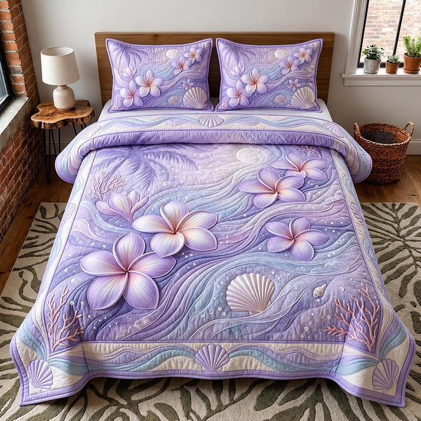 Tropical Blossom quilted 3-piece bedding set on a made bed in a light coastal bedroom