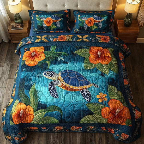 Tropical Blue quilted 3-piece bedding set on a made bed in a light coastal bedroom