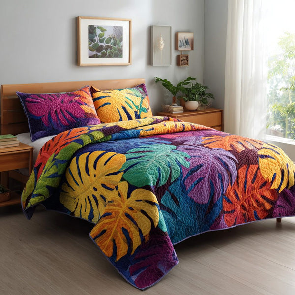 Tropical Canopy quilted 3-piece bedding set on a made bed in a light coastal bedroom