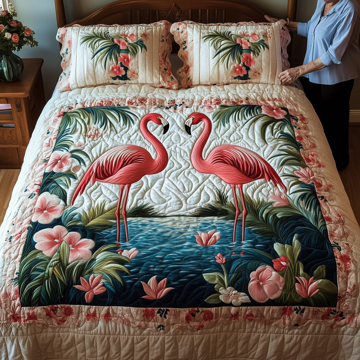 Tropical Flamingo Haven quilted 3-piece bedding set on a made bed in a light coastal bedroom
