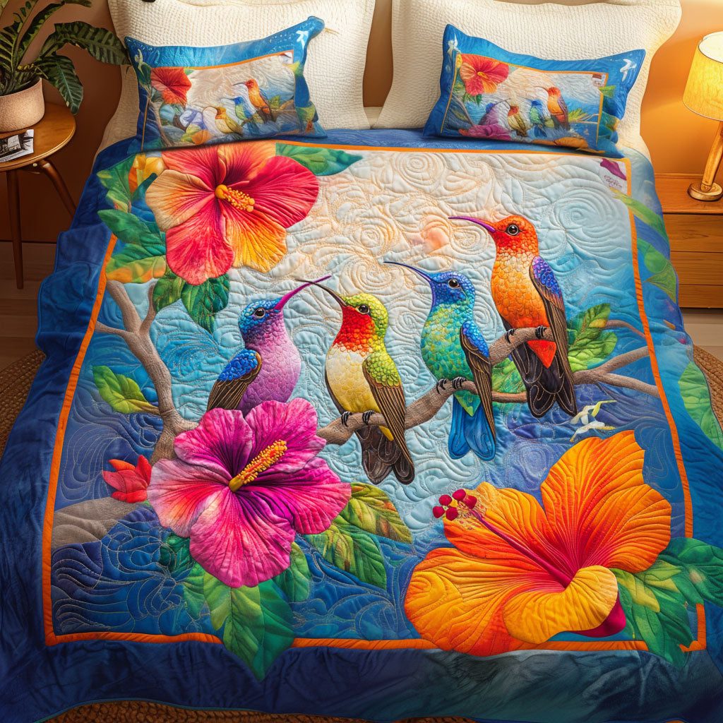 Tropical Hummingbird Bloom quilted 3-piece bedding set on a made bed in a light coastal bedroom