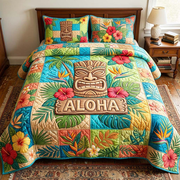 Tropical Mask quilted 3-piece bedding set on a made bed in a light coastal bedroom