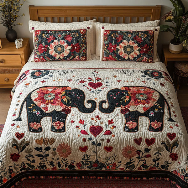 Trunk-ly in Love quilted 3-piece bedding set on a made bed with two matching pillow shams