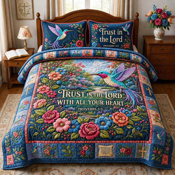 Trusting Hummingbird Grace quilted 3-piece bedding set on a made bed with two matching pillow shams
