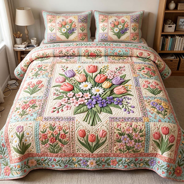 Tulip Bouquet quilted 3-piece bedding set on a made bed with two matching pillow shams