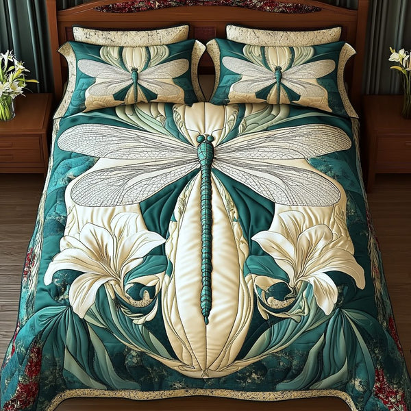 Turquoise Dragonfly Bliss quilted 3-piece bedding set on a made bed with two matching pillow shams