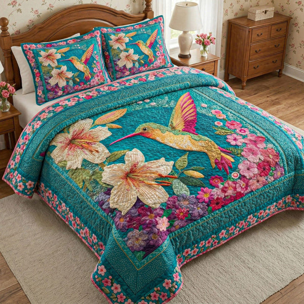 Turquoise Lily Garden quilted 3-piece bedding set on a made bed with two matching pillow shams