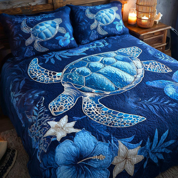 Turtle Oasis quilted 3-piece bedding set on a made bed in a light coastal bedroom