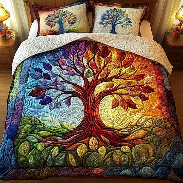 Twilight Bloom quilted 3-piece bedding set on a made bed with two matching pillow shams