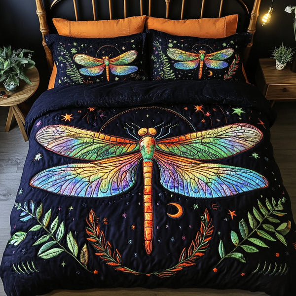 Twilight Dragonfly quilted 3-piece bedding set on a made bed with two matching pillow shams