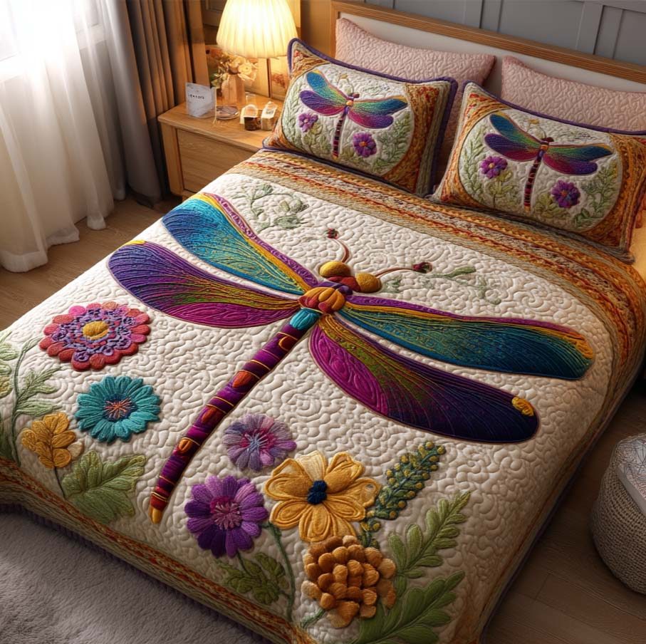 Twilight Dragonfly quilted 3-piece bedding set on a made bed with two matching pillow shams
