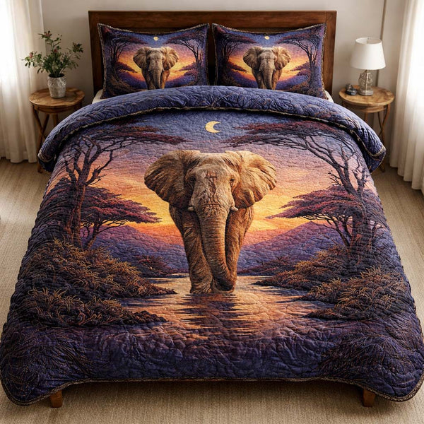 Twilight Elephant quilted 3-piece bedding set on a made bed with two matching pillow shams