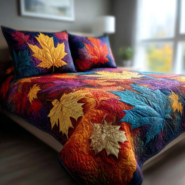 Twilight Leaves quilted 3-piece bedding set on a made bed with two matching pillow shams