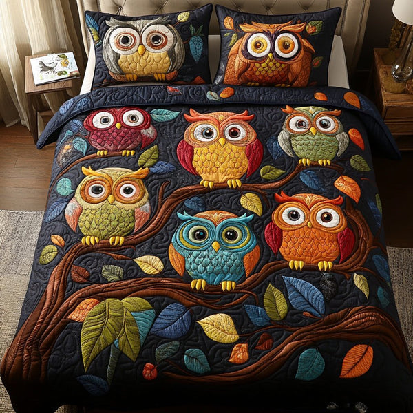 Twilight Owls quilted 3-piece bedding set on a made bed with two matching pillow shams