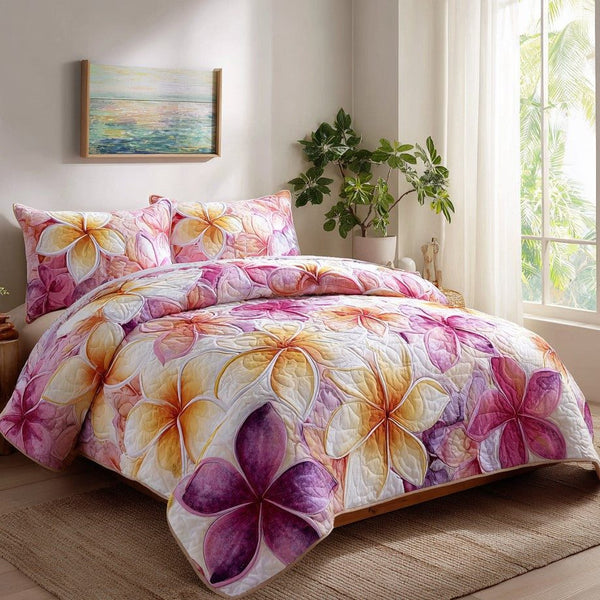 Twilight Tropic quilted 3-piece bedding set on a made bed with two matching pillow shams