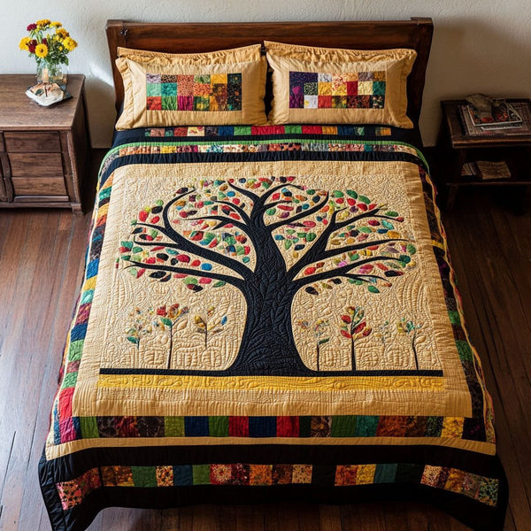 Unity Tree quilted 3-piece bedding set on a made bed with two matching pillow shams