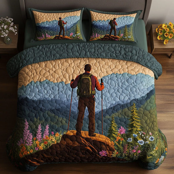 Valley Vista Trek quilted 3-piece bedding set on a made bed with two matching pillow shams