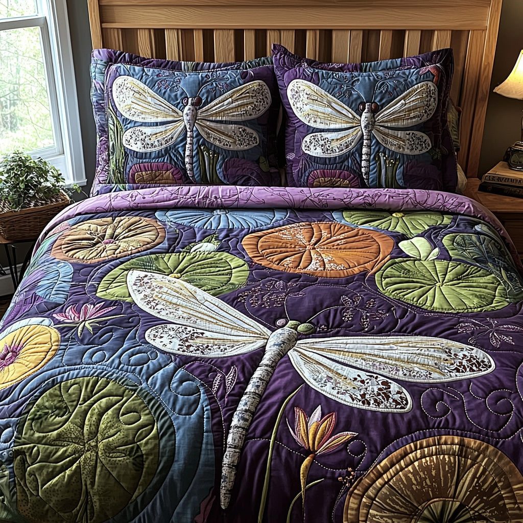 Velvet Dragonfly quilted 3-piece bedding set on a made bed with two matching pillow shams