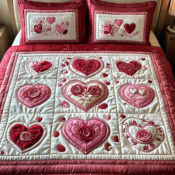 Velvet Heart quilted 3-piece bedding set on a made bed with two matching pillow shams