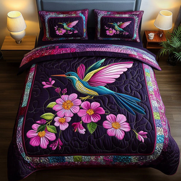 Velvet Hover quilted 3-piece bedding set on a made bed with two matching pillow shams