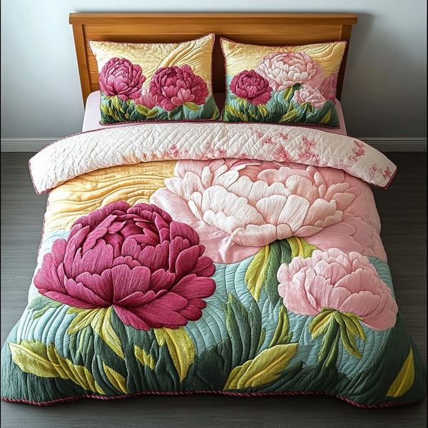 Velvet Petals quilted 3-piece bedding set on a made bed with two matching pillow shams
