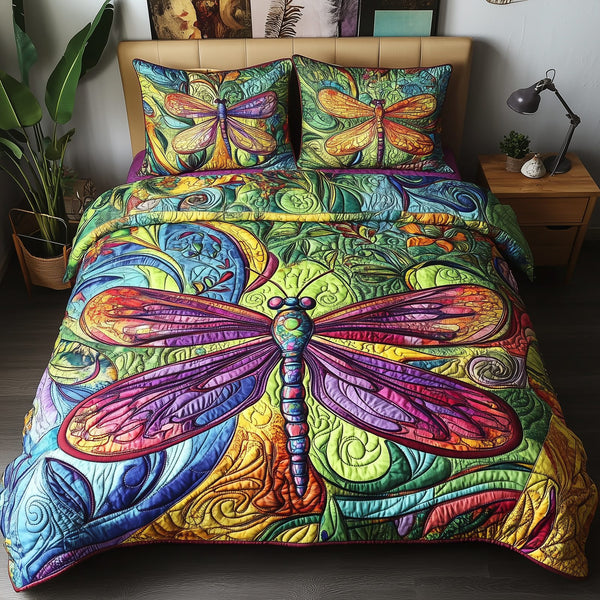 Vibrant Dragonfly quilted 3-piece bedding set on a made bed with two matching pillow shams