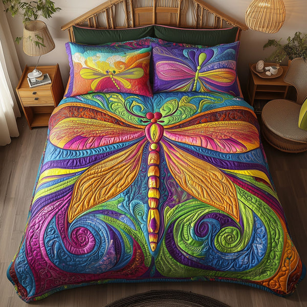 Vibrant Dragonfly quilted 3-piece bedding set on a made bed with two matching pillow shams