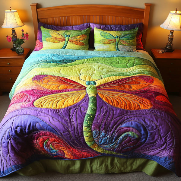 Vibrant Dragonfly quilted 3-piece bedding set on a made bed with two matching pillow shams