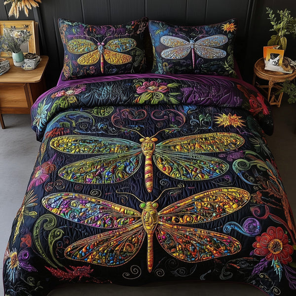 Vibrant Dragonfly quilted 3-piece bedding set on a made bed with two matching pillow shams