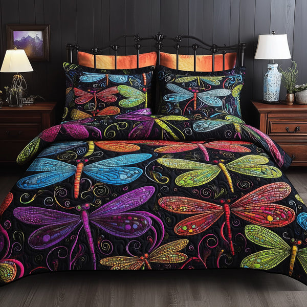 Vibrant Dragonfly quilted 3-piece bedding set on a made bed with two matching pillow shams