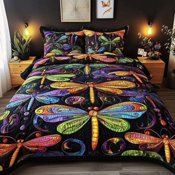 Vibrant Dragonfly quilted 3-piece bedding set on a made bed with two matching pillow shams