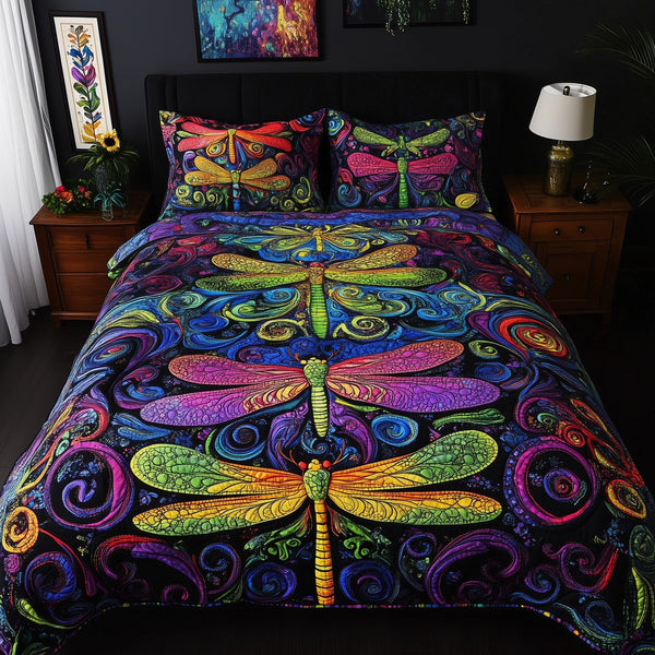 Vibrant Dragonfly quilted 3-piece bedding set on a made bed with two matching pillow shams