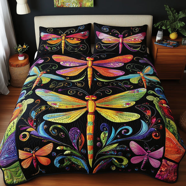 Vibrant Dragonfly quilted 3-piece bedding set on a made bed with two matching pillow shams
