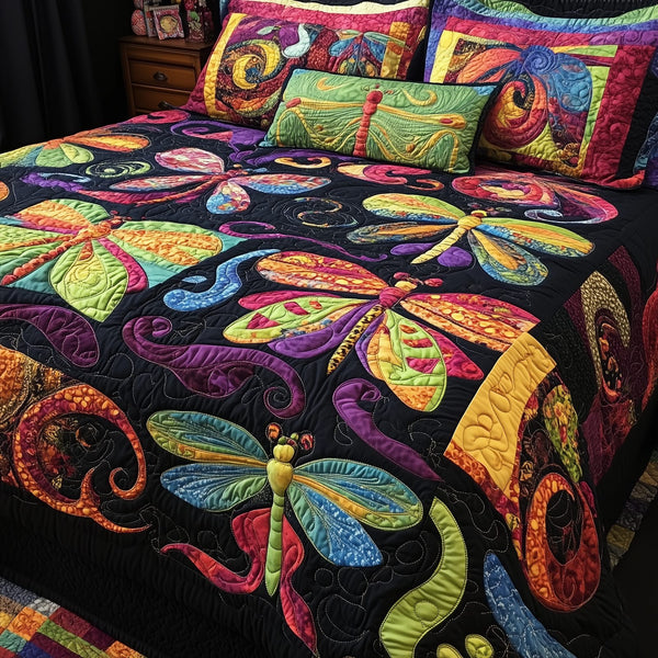 Vibrant Dragonfly quilted 3-piece bedding set on a made bed with two matching pillow shams