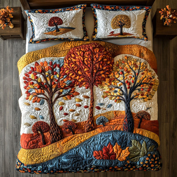 Vibrant Fall quilted 3-piece bedding set on a made bed with two matching pillow shams
