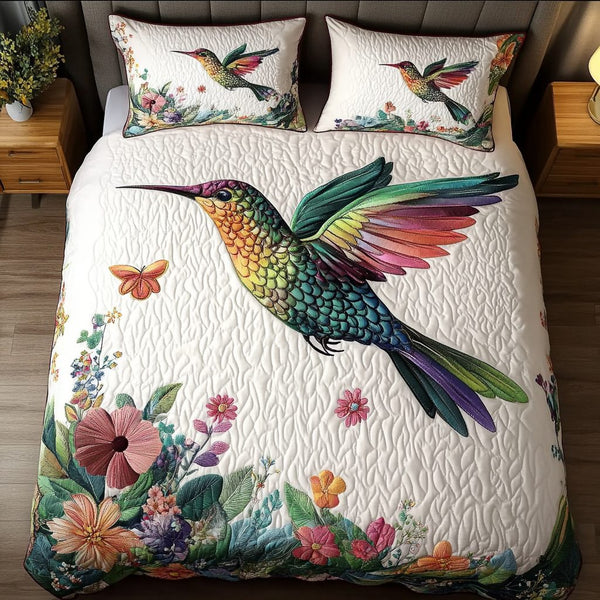Vibrant Flight quilted 3-piece bedding set on a made bed with two matching pillow shams