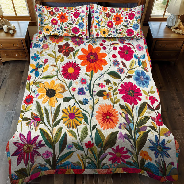 Vibrant Flowers quilted 3-piece bedding set on a made bed with two matching pillow shams