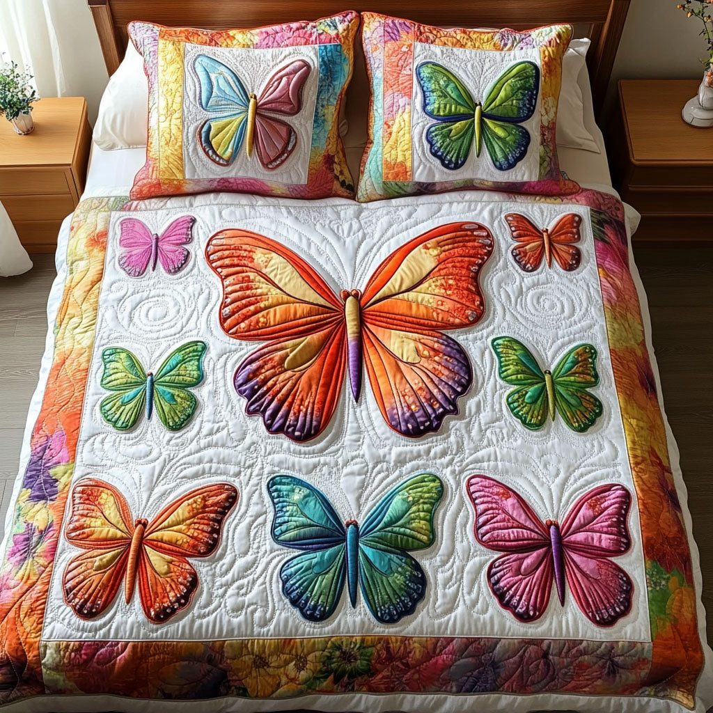 Vibrant Garden Butterflies quilted 3-piece bedding set on a made bed with two matching pillow shams