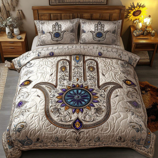 Vibrant Hands quilted 3-piece bedding set on a made bed with two matching pillow shams