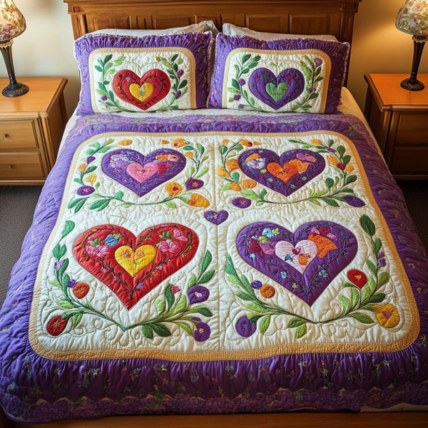 Vibrant Heart Patch quilted 3-piece bedding set on a made bed with two matching pillow shams
