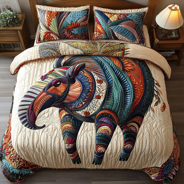 Vibrant Journey quilted 3-piece bedding set on a made bed with two matching pillow shams