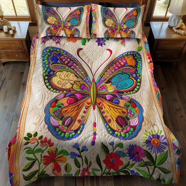 Vibrant Mandala Butterfly quilted 3-piece bedding set on a made bed with two matching pillow shams