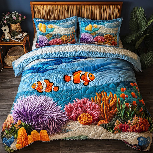 Vibrant Seas quilted 3-piece bedding set on a made bed with two matching pillow shams