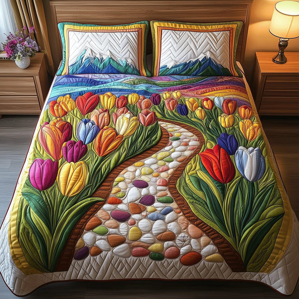 Vibrant Tulip Fields quilted 3-piece bedding set on a made bed with two matching pillow shams