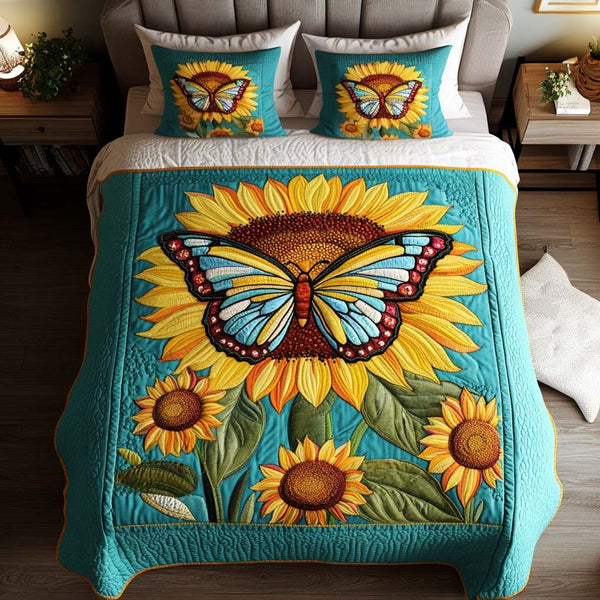Vibrant Wings Symphony quilted 3-piece bedding set on a made bed with two matching pillow shams