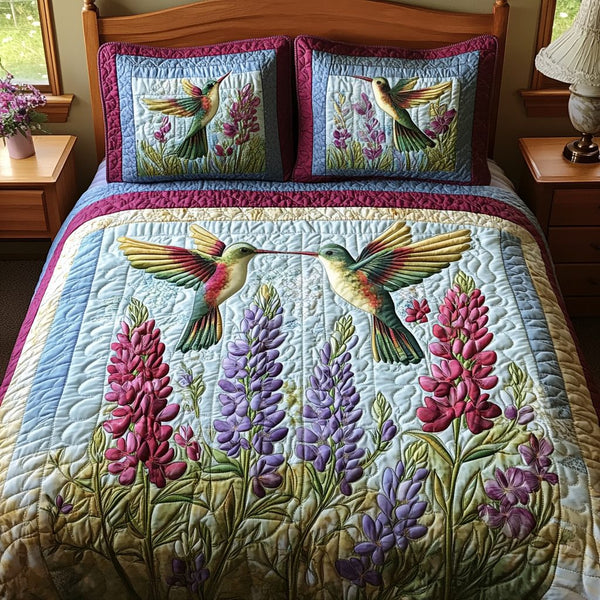 Vibrant Wingscape quilted 3-piece bedding set on a made bed with two matching pillow shams