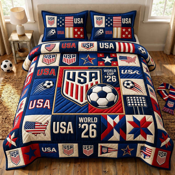 Victory Soccer Blocks quilted 3-piece bedding set on a made bed with two matching pillow shams